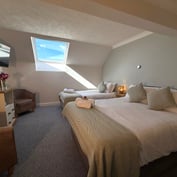 Triple room wider view, single bed and double bed under the skylight