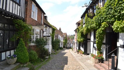 Mermaid Street in Rye — a cobbled lane of timber-framed buildings, with the ivy-clad Mermaid Inn on the right