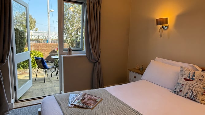 An ensuite river-view room at the River Haven Hotel